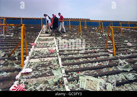 Soccer - FA Cup - Round 6 - Chesterfield v Wrexham - Saltergate. Wrexham fans leave the litter strewn terracing of Saltergate after their team was knocked out the cup by Chesterfield Stock Photo