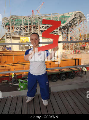 Paralympian double gold medallist Ellie Simmonds views the Olympic Park and Aquatic Centre at Stratford in London three years before the games are due to start. Stock Photo