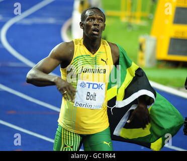 Jamaica's Usain Bolt celebrates winning the men's 100m final in a new world record time of 9.58 seconds during the IAAF World Championships at the Olympiastadion, Berlin. Stock Photo