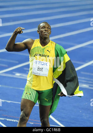 Jamaica's Usain Bolt celebrates winning the men's 100m final in a new world record time of 9.58 seconds during the IAAF World Championships at the Olympiastadion, Berlin. Stock Photo