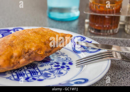 Crispy deep fried spring roll on a chinese plate, served with spicy red sauce Stock Photo