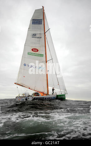 Mike Perham, 17, approaches the finish line off the Lizard in Cornwall, to became the youngest person to sail solo around the world with assistance. Stock Photo