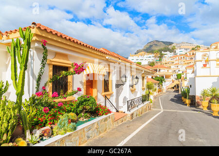 Street with typical Canary style holiday apartments in Costa Adeje, Tenerife, Canary Islands, Spain Stock Photo