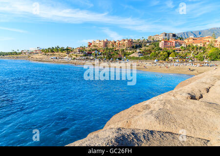 Paradise El Duque beach with azure water and hotels in background in Costa Adeje town, Tenerife, Canary Islands, Spain Stock Photo