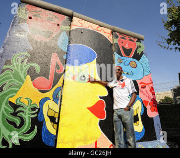 Great Britain's Phillips Idowu poses for the media at the Berlin Wall after he held a Press Conference on an open air tour bus during the IAAF World Championships at the Olympiastadion, Berlin. Stock Photo