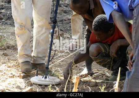 In the wild golden Poura mine in western Burkina Faso, a French arrived with a powerful metal detector Stock Photo