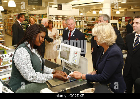 The Prince of Wales and the Duchess of Cornwall pay for some groceries in a Waitrose store in Belgravia, central London. Stock Photo