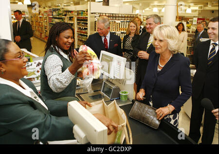 The Prince of Wales and the Duchess of Cornwall pay for some groceries in a Waitrose store in Belgravia, central London. Stock Photo