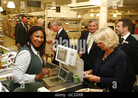 The Prince of Wales and the Duchess of Cornwall pay for some groceries in a Waitrose store in Belgravia, central London. Stock Photo