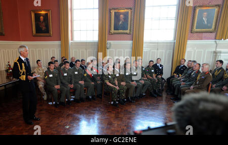 Second Sea Lord Vice Admiral Sir Alan Massey (left) speaks during the latest Operational Honours and Awards list ceremony in Royal Marines Stonehoue in Plymouth. Stock Photo