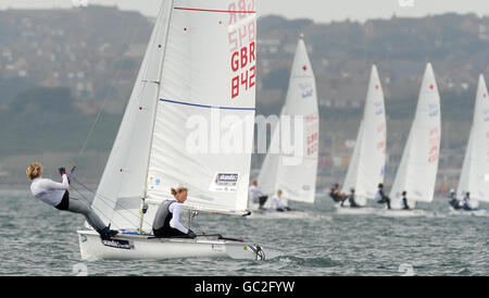 Great Britain's Pippa Wilson and Saskia Clark go on to win a Bronze medal in the women's 470 class during the Skandia Sail for Gold Regatta on the English Channel. Stock Photo