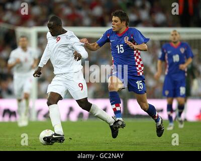 Soccer - FIFA World Cup 2010 - Qualifying Round - Group Six - England v Croatia - Wembley Stadium. England's Emile Heskey gets away from Croatia's Ognjen Vukojevic Stock Photo