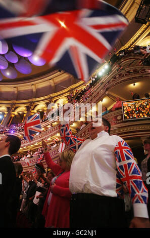 Concert goers enjoy the celebrations during the Last Night of the Proms at the Royal Albert Hall in London. Stock Photo