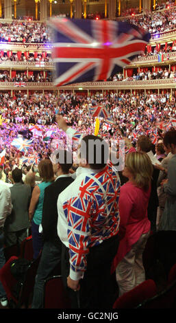 Concert goers enjoy the celebrations during the Last Night of the Proms at the Royal Albert Hall in London. Stock Photo