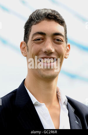 Sultan Kosen, from Turkey, is announced as the Guinness World Records Tallest Man standing at 8ft 1, seen in Potters Field in London. Stock Photo