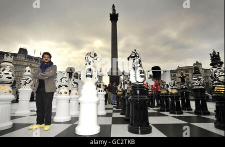 Spanish artist Jaime Hayon with his giant chess pieces which form part of his installation, The Tournament, in London's Trafalgar Square to mark the start of The London Design Festival.