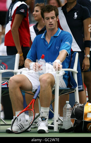 Great Britains' Andy Murray takes a break during his match against Croatias' Marin Cilic. Stock Photo