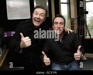 Guest Ricky Gervais (left) with Absolute Radio Breakfast Show presenter Christian O'Connell at Absolute Radio in Golden Square, central London. Stock Photo