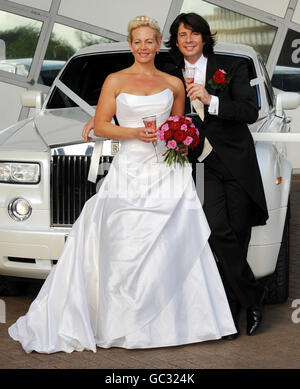 Designer and presenter Laurence Llewelyn-Bowen and wife Jackie, a wedding planner, open the National wedding Show at Earls Court 2, London today. Stock Photo