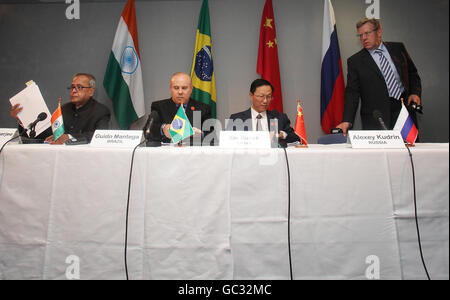 Alexei Kudrin, Russia's finance minister, right, joins a table with Xie Xuren, China's finance minister, second right, Pranab Mukherjee, India's finance minister, left, and Guido Mantega, Brazil's finance minister during a press conference for the BRIC nations - Brazil, Russia, India and China during the G20 finance ministers meeting in London. Stock Photo