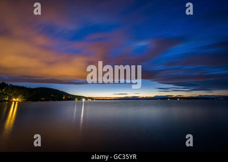 Long exposure of clouds moving over Lake Winnipesaukee at night, at Ellacoya State Park, in Laconia, New Hampshire. Stock Photo