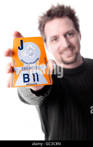Man with Austrian motorway permit sticker 2011 Stock Photo