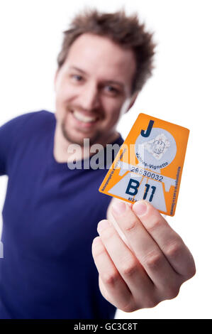 Man with Austrian motorway permit sticker 2011 Stock Photo
