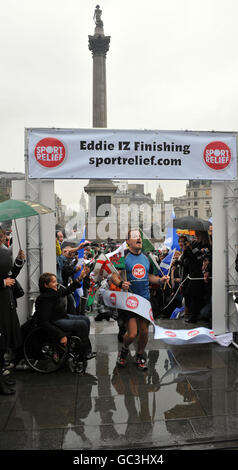 Comedian Eddie Izzard reaches the finish line after completing his 1,100mile run around the UK, in support of Sport Relief. Stock Photo