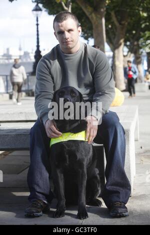 Brad Ranson 16  from Durham with his Guide Dog Lance, one of the first four people under sixteen to qualify for a Guide Dog in the UK who were united for the first time on London's Southbank. Press Association Photo. Date Sunday 04 October 2009. Over 18,000 blind and partially sighted youngsters are missing out on crucial help with mobility, independence and life skills according to research by Guide Dogs. Picture Credit should read David Parry/ PA Stock Photo