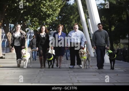 The first four people under sixteen to qualify for a Guide Dog in the UK who were united for the first time on London's Southbank. L-R Kirsty Meinhardt 15 with Websta, Andrea Cooper 18 with Cara, Bridget Warr CEO Guide Dogs, Sidney Tamblin 18 with Jamie and Brad Ranson 16 with Lance. Press Association Photo. Date Sunday 04 October 2009. Over 18,000 blind and partially sighted youngsters are missing out on crucial help with mobility, independence and life skills according to research by Guide Dogs. Picture Credit should read David Parry/ PA Stock Photo
