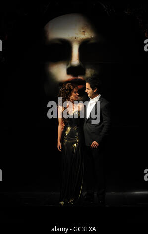 Sierra Boggess (left) who plays Christie and Ramin Karimloo who plays the Phantom during a during a photocall for Andrew Lloyd Webber's new musical, Love Never Dies, a continuation of Phantom of the Opera, at Her Majesty's Theatre in central London. Stock Photo