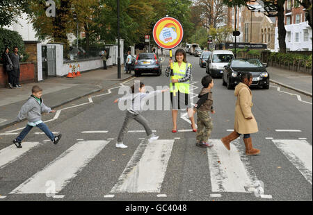 TV presenter Lorraine Kelly stops the traffic at the Abbey Road pedestrian crossing, in London, during the launch of the Lollipop Person of the Year Awards 2009. Stock Photo