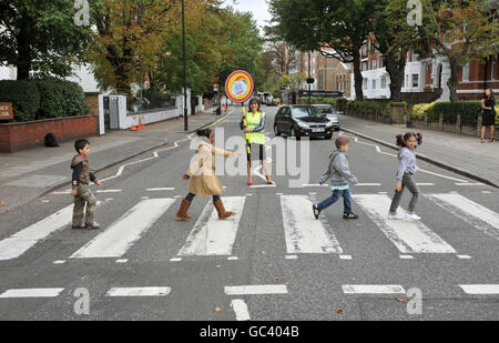 TV presenter Lorraine Kelly stops the traffic at the Abbey Road pedestrian crossing, in London, during the launch of the Lollipop Person of the Year Awards 2009. Stock Photo