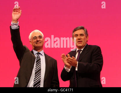 Chancellor of the Exchequer Alistair Darling is applauded by Prime Minister Gordon Brown following his speech at the Labour Party Conference, in Brighton, Sussex. Stock Photo