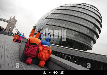 Bodies in Urban Spaces a human artwork by Austrian artist Willi Dorner, near the Mayor's Office on London's Southbank today. The 'moving body trail' featuring 24 performers is taking place in the Tower Bridge area until Sunday. Stock Photo