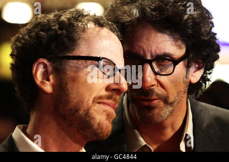 Directors Joel (right) and Ethan Coen arrive for the London Film Festival screening of their film A Serious Man, at the Vue West End in Leicester Square, central London. Stock Photo