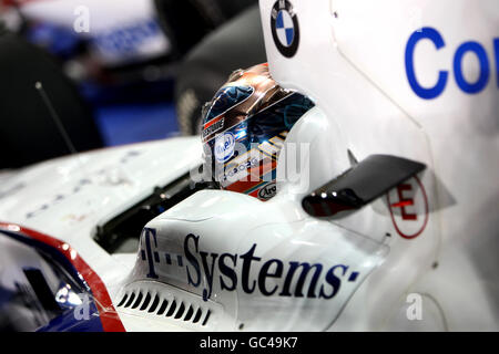 BMW Sauber's Robert Kubica waits in the garage during qualifying for the Abu Dhabi Grand Prix at the Yas Marina Circuit, United Arab Emirates. Stock Photo