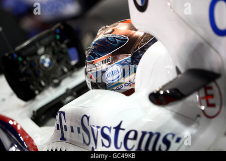 BMW Sauber's Robert Kubica waits in the garage during qualifying for the Abu Dhabi Grand Prix at the Yas Marina Circuit, United Arab Emirates. Stock Photo