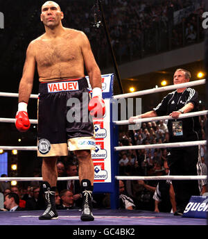 Russia's Nikolai Valuev stands his 7ft 2 inch tall as his cornerman gives him advice during the WBA World Heavyweight Title bout at the Nuremberg Arena, Germany. Stock Photo