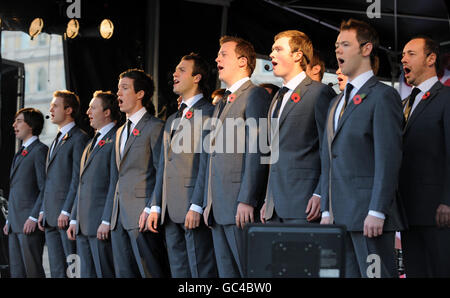 Welsh male voice choir Only Men Aloud perform during a public Remembrance Day concert and poetry reading in Trafalgar Square, London hosted by the Royal British Legion. Stock Photo