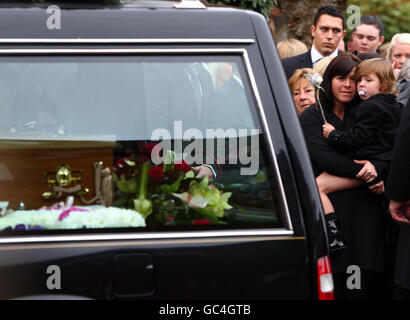 Colette Bysouth mother of Neve Lafferty watches her daughters coffin as it leaves St Joseph's Catholic Church in Helensburgh, Scotland where mourners gathered for the funeral of the 15-year-old girl who jumped from the Erskine Bridge to her death in an apparent suicide pact along with Georgia Rowe, 14, earlier this month. Stock Photo