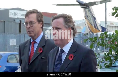 Ian Monk (right), the spokesman for freed mercenary Simon Mann, speaks to the media at Luton airport, after Mr Mann arrived back in the UK.
