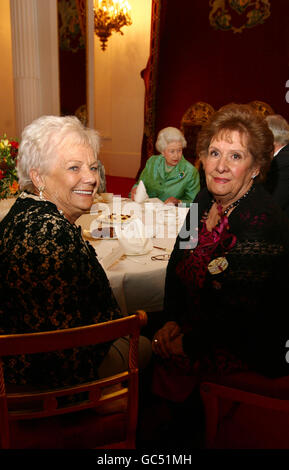 Nora Morgan (right), 81, from Ellesmere in Shropshire, and Ella Kimball Evans (left), 83, from Criftins, near Ellesmere, Shropshire, attend a Women's Land Army and Timbers Corps Tea hosted by Queen Elizabeth II, inside Buckingham Palace in central London. Stock Photo