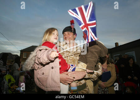 Major Jo Butterfill, Officer Commanding, A Company Group, The Second Battalion The Royal Regiment Of Fusiliers (2 RRF) with his daughter Tabitha, 3, and son Archie, 1, as he arrives back at his barracks in West London after a six month tour of duty in Afghanistan's Helmand province. Stock Photo