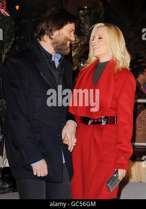 Jim Carrey and Jenny McCarthy arrive for the world premiere of Disney's A Christmas Carol in Leicester Square central London. Stock Photo