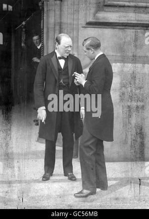 Winston Churchill, left, and Prince Edward (Prince of Wales) share a cigar after attending a luncheon at the House of Commons for US airmen who flew the Atlantic. Stock Photo