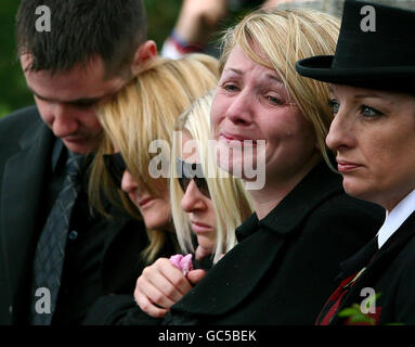 The family of Guardsman Jamie Janes of the 1st Battalion Grenadier Guards, watch his coffin leave St Philips Church in Hove, East Sussex, following his death in Afghanistan earlier this month. Stock Photo