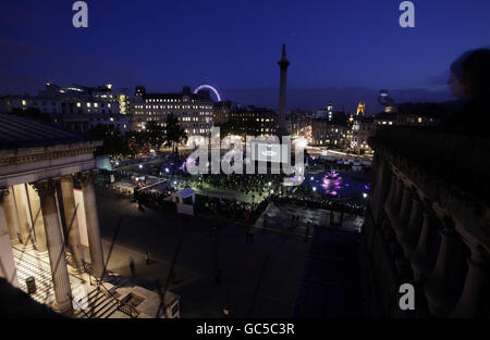 A free public screening of a series of short films about London through the ages is shown on a large screen in Trafalgar Square, central London, during The Times BFI London Film Festival. As seen from the roof of the National Portrait Gallery. Stock Photo