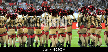 American Football - NFL - New England Patriots v Tampa Bay Buccaneers - Wembley Stadium. Tampa Bay Buccaneers' cheerleaders entertain the crowd before the start of the NFL match at Wembley Stadium, London. Stock Photo