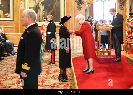 Dr. Penelope Dobson from Bristol is made an MBE by Britain's Queen Elizabeth II at Windsor Castle. Stock Photo